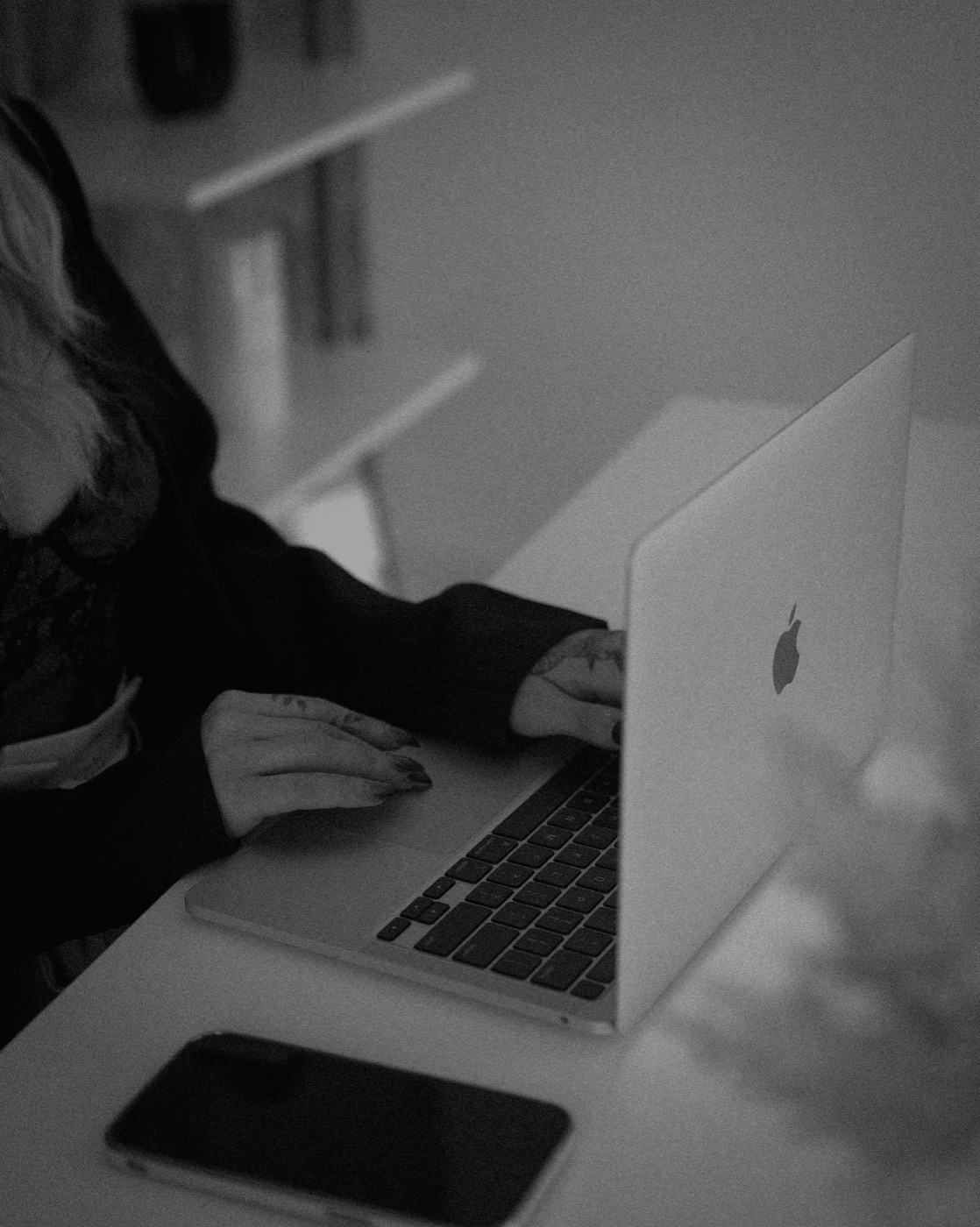 Hands on a laptop keyboard